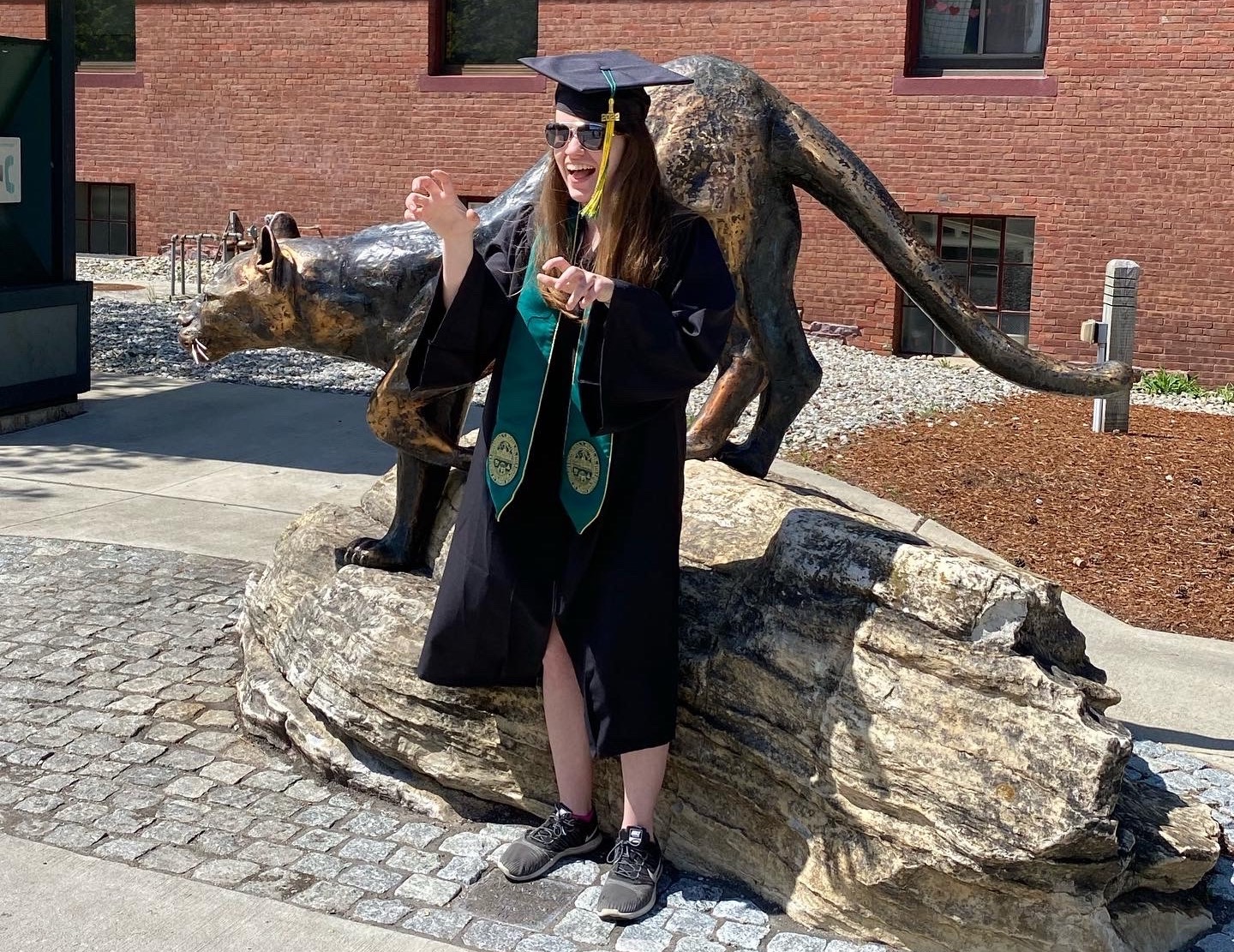 Sarah Grobe posing with the UVM Catamount